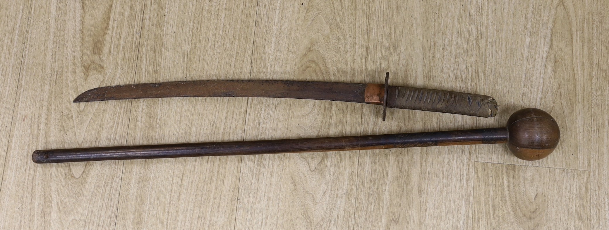 A Japanese wakizashi (corroded) with signed tang and a South African ebony knobkerrie, 80cm long